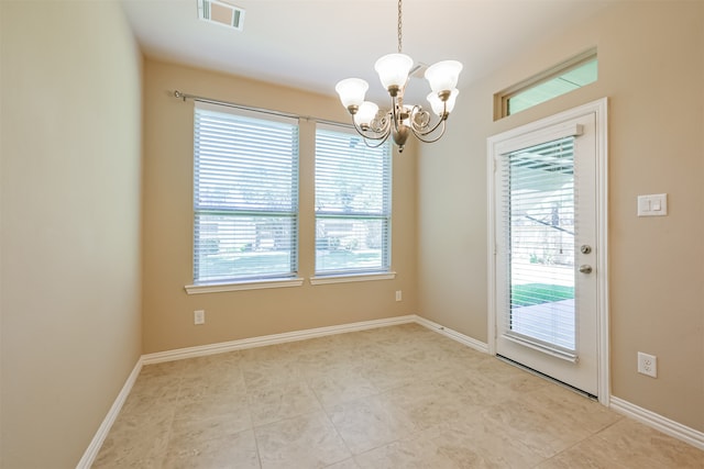 interior space with plenty of natural light and a notable chandelier