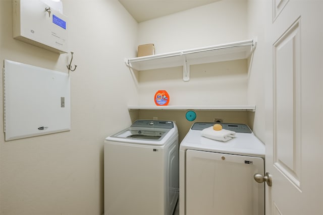 clothes washing area featuring washing machine and clothes dryer