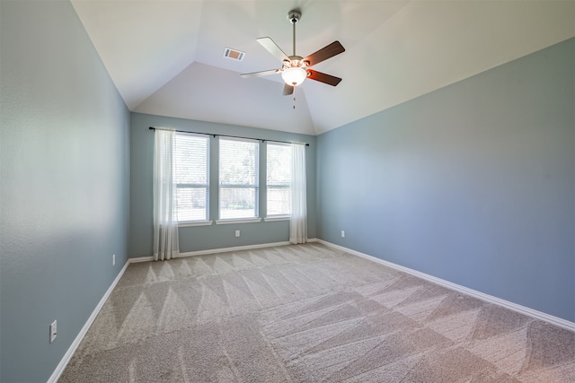 carpeted empty room with lofted ceiling and ceiling fan