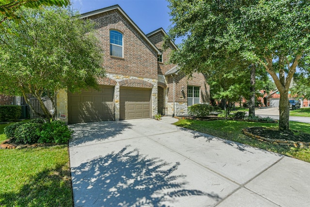 view of front of house featuring a garage and a front yard