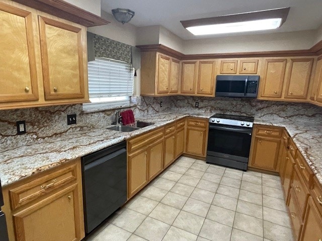 kitchen with black dishwasher, electric stove, tasteful backsplash, sink, and light tile patterned floors