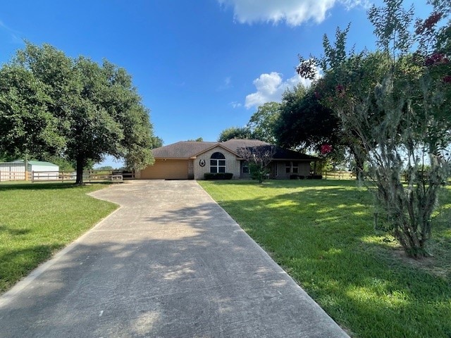 ranch-style home featuring a front lawn