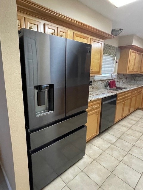 kitchen with light tile patterned flooring, fridge with ice dispenser, dishwasher, backsplash, and sink