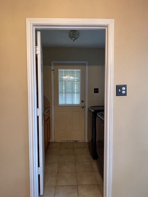 interior space featuring tile patterned flooring and separate washer and dryer