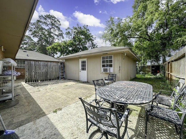 view of patio / terrace featuring outdoor dining area and a fenced backyard