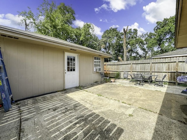 view of patio / terrace featuring fence