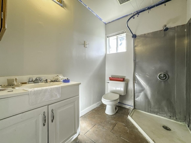 full bath featuring toilet, a shower stall, baseboards, and vanity