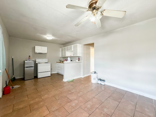 kitchen with white cabinetry, electric stove, ceiling fan, stainless steel refrigerator, and light tile patterned floors