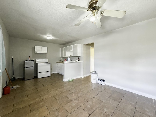 kitchen with ceiling fan, white electric range, white cabinetry, baseboards, and freestanding refrigerator