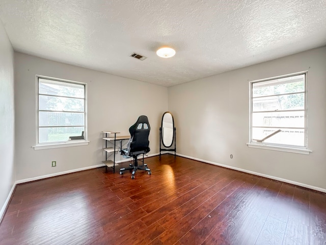 office space featuring hardwood / wood-style flooring and a textured ceiling