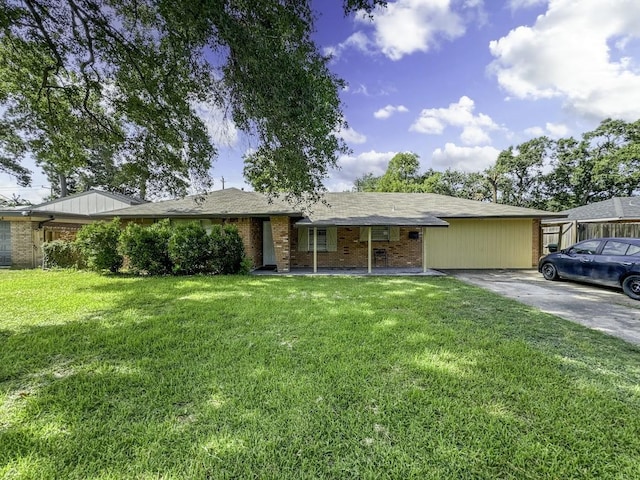 ranch-style house featuring a front yard, brick siding, and driveway