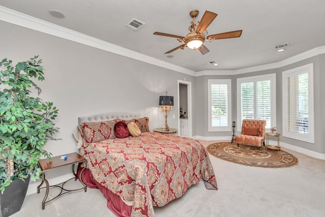 bedroom with carpet floors, crown molding, and ceiling fan