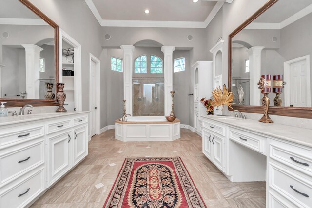 bathroom with tile patterned flooring, independent shower and bath, decorative columns, and ornamental molding