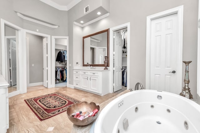 bathroom featuring vanity and ornamental molding