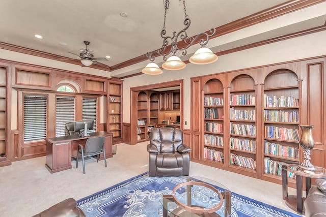 office space featuring ornamental molding, light carpet, and built in features