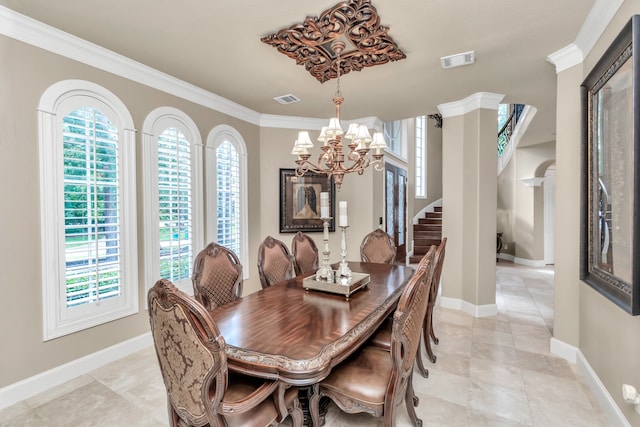 dining space featuring light tile patterned flooring, crown molding, ornate columns, and a notable chandelier