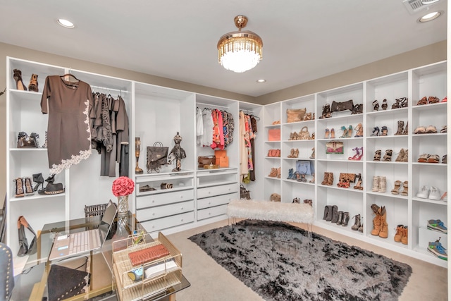 walk in closet featuring carpet floors