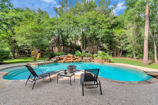 view of pool featuring an in ground hot tub and a patio