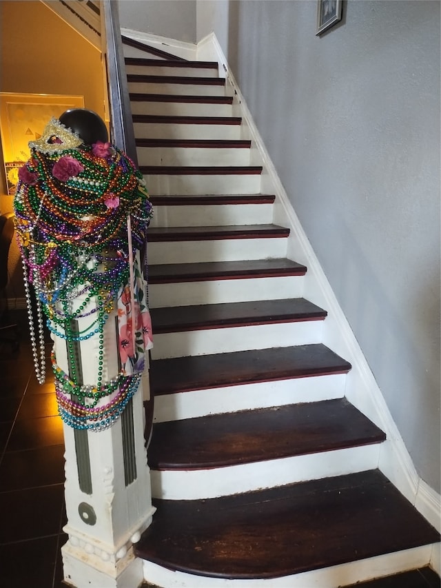 stairs with tile patterned floors