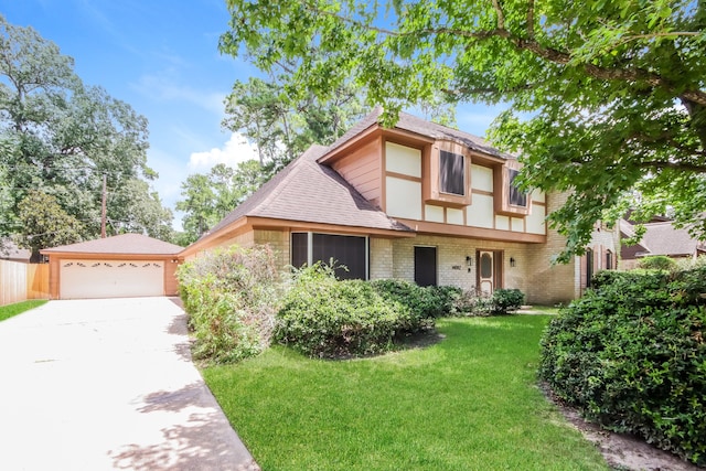 view of front of property featuring a front lawn and a garage