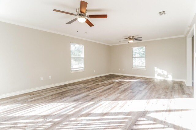 unfurnished room with ceiling fan, ornamental molding, and light wood-type flooring