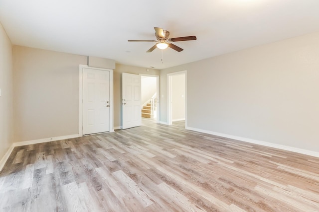 empty room featuring light hardwood / wood-style floors and ceiling fan