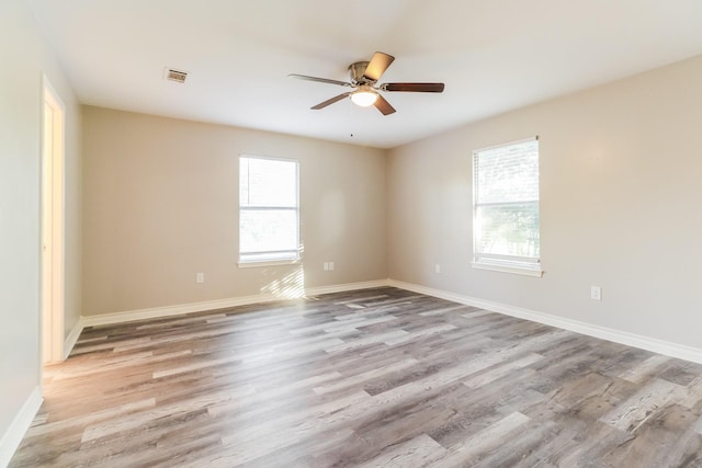 unfurnished room featuring ceiling fan and light wood-type flooring