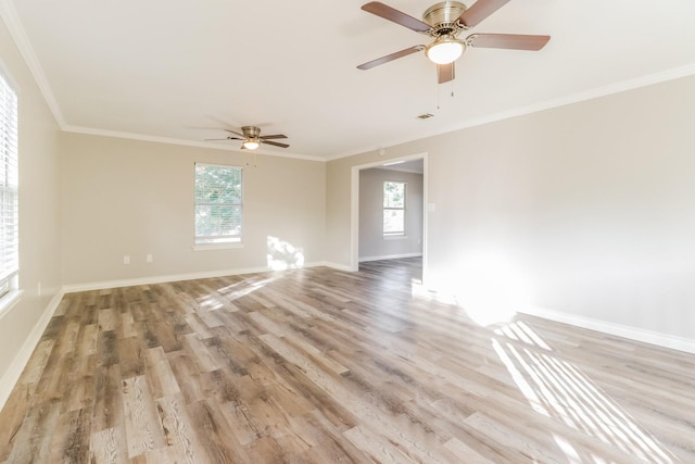 unfurnished room with ceiling fan, ornamental molding, and light wood-type flooring