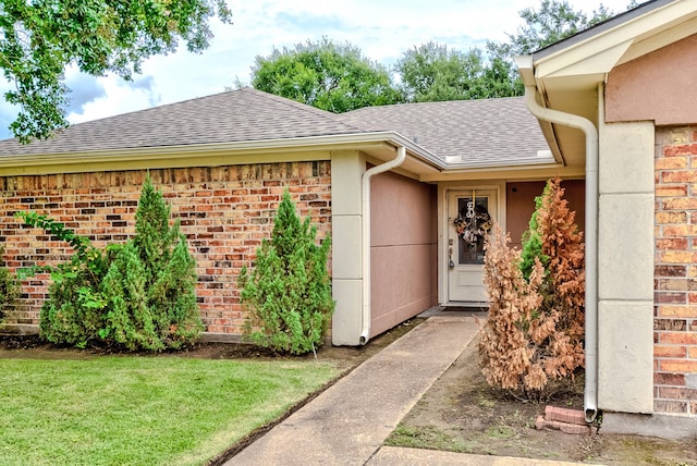 property entrance with a yard