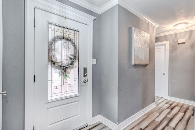 entrance foyer with crown molding and hardwood / wood-style flooring