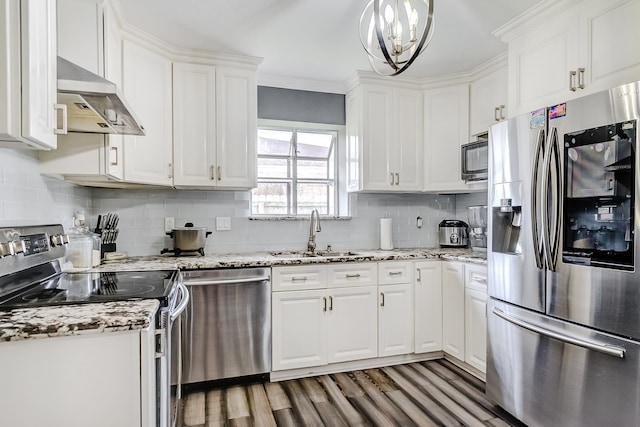 kitchen featuring hardwood / wood-style floors, stainless steel appliances, sink, ventilation hood, and white cabinetry