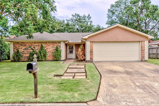 ranch-style home featuring a front yard and a garage