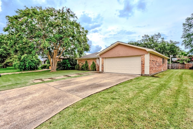 single story home featuring a front yard and a garage