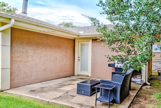 doorway to property with a patio area