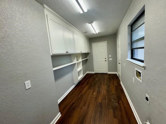 hallway featuring dark hardwood / wood-style floors