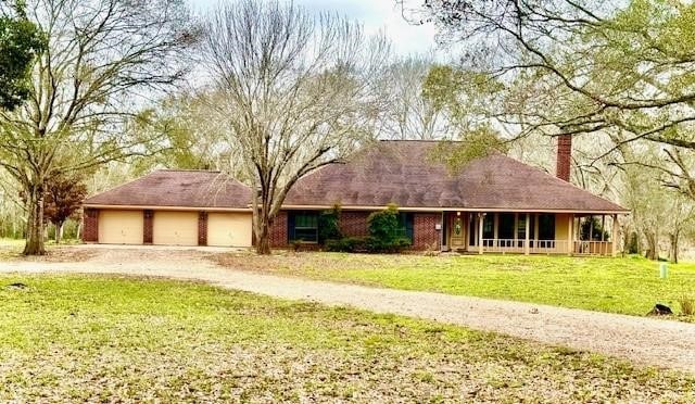 view of front of property with a garage and a front lawn