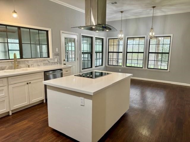 kitchen with black electric stovetop, white cabinetry, dark hardwood / wood-style flooring, island exhaust hood, and an inviting chandelier