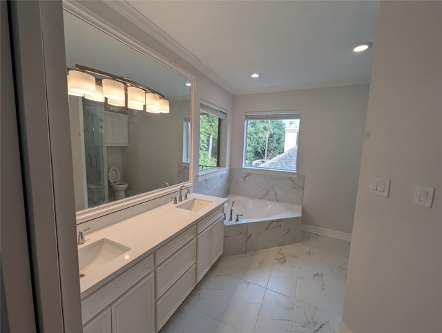 bathroom featuring ornamental molding, toilet, vanity, and tiled tub