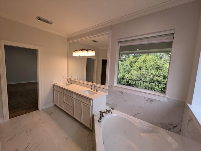 bathroom with vanity, a washtub, and crown molding