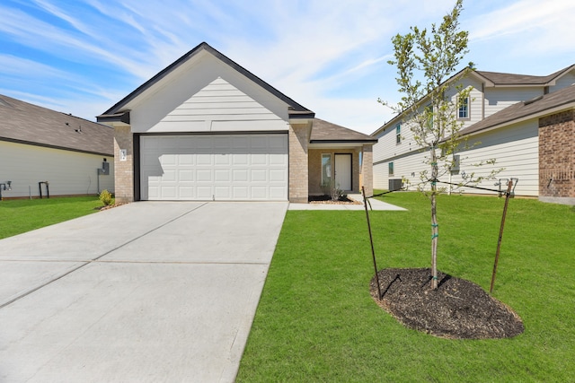 view of front facade with a garage and a front lawn