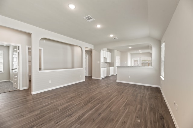 unfurnished living room featuring dark hardwood / wood-style flooring