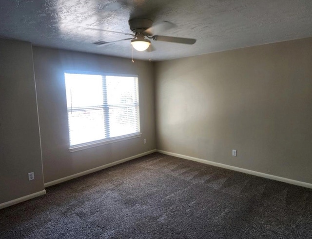 empty room with carpet, a textured ceiling, and ceiling fan