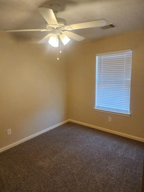 carpeted empty room with ceiling fan