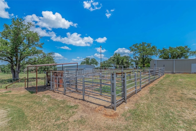 view of yard featuring a rural view and an outdoor structure