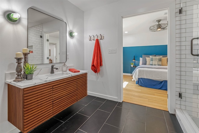 bathroom featuring vanity, an enclosed shower, and hardwood / wood-style flooring