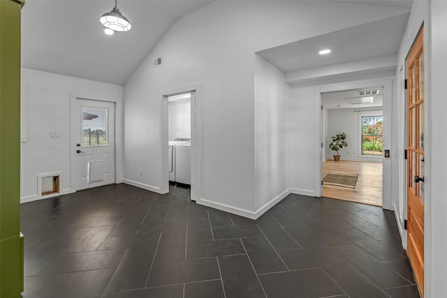 798 Lcr 703, Kosse, TX 76653 - entryway with washing machine and clothes dryer, plenty of natural light, recessed lighting, dark tile patterned floors, and high vaulted ceiling