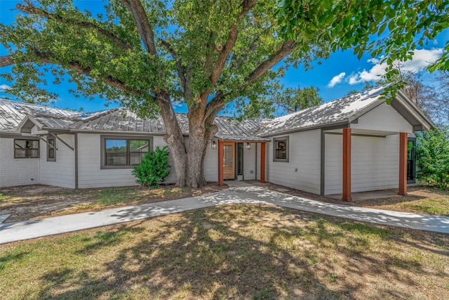 798 Lcr 703, Kosse, TX 76653 - ranch-style house with a metal roof and a front yard