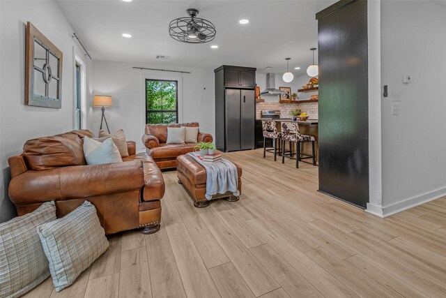 798 Lcr 703, Kosse, TX 76653 - living room with light wood-type flooring and recessed lighting