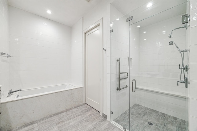 bathroom featuring plus walk in shower