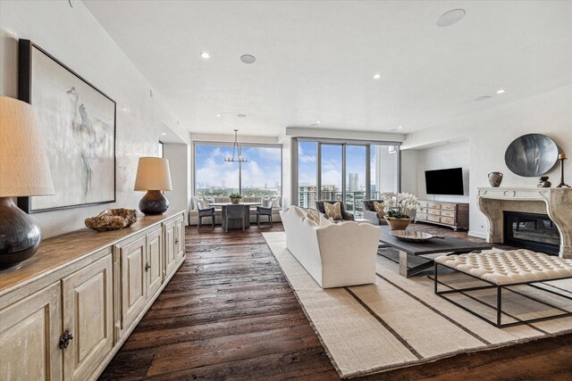 living room featuring dark hardwood / wood-style floors and a high end fireplace